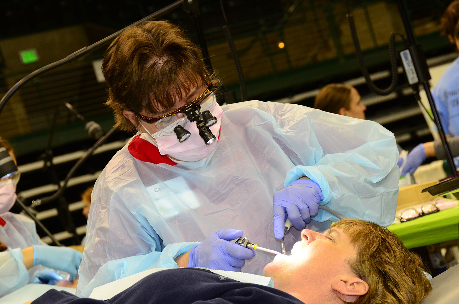Dentist With Patient at Mission of Mercy