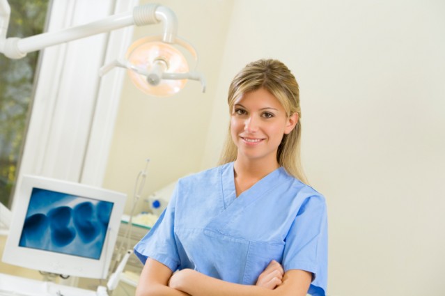 young dental assistant smiling